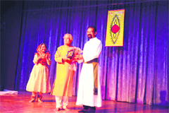AJ George, Principal of St Josephs Academy, felicitates Pandit Birju Maharaj