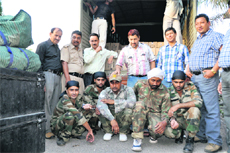 Liquor smugglers in Army uniform in police custody in Dehradun on Friday.