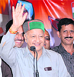 Union Minister Virbhadra Singh addresses a rally in Solan on Saturday