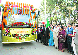 Horticulture Minister Narinder Bragta flags off a Volvo bus in Shimla on Friday