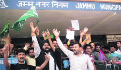Activists of the youth wing of the Peoples Democratic Party stage a protest against the municipal authorities in Jammu