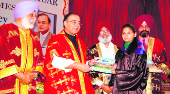 Arun Jaitley, Leader of Opposition in Rajya Sabha, presents a degree to a student during the annual convocation at Khalsa College in Amritsar on Sunday.