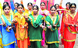 Girls participate in Baisakhi celebrations organised by the Residents Welfare Association, Sector 46, Chandigarh, on Sunday.
