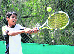 Gurjot Sidhu returns a shot during a match at the CLTA-AITA Super Series Tennis Tournament on Sunday.