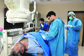 Dr Yoginder Singh, a cardiologist, performs an angiography at Coronation Hospital in Dehradun on Saturday.