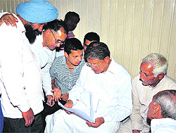 Union Minister of State for Parliamentary Affairs Harish Rawat meets party workers and public at the Damkoti state guest house in Haridwar on Sunday