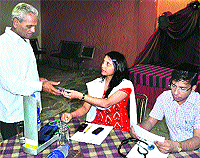 Marma experts examine a patient at a workshop at Kankhal in Haridwar on Sunday