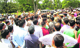 The police tries to control agitating tractor owners at Nurpur on Sunday.