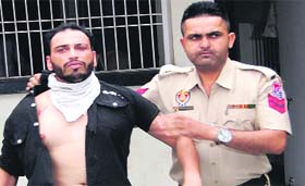 Michal, who fired in the air, in police custody in Jalandhar on Sunday