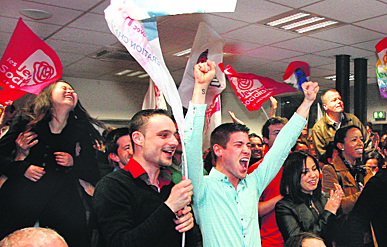 Supporters of Francois Hollande, Socialist Party candidate for the French presidential election, react to first-round results in Lyon.