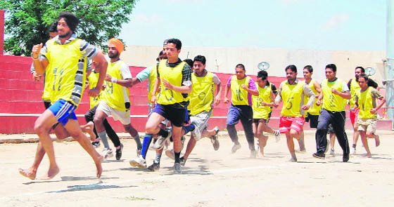 Aspirants take part in a police recruitment drive at the Gandhi ground in Amritsar on Monday. 