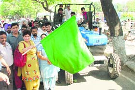 Mayor Raj Bala Malik flags off a garbage-collection trolley at Sector 22 in Chandigarh on Monday