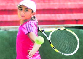 Sabhyat plays a shot during the under-14 tennis match at CLTA, Sector 10, Chandigarh, on Monday