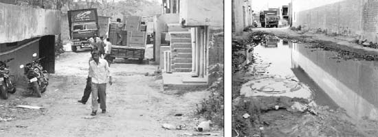 Vehicles parked in the middle of a road; and (right) a potholed road at Bhabat village in Zirakpur