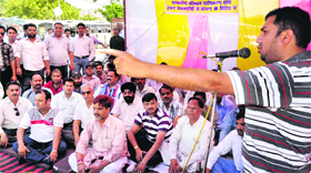 Travel and tour operators protest in support of their demand outside the City Magistrates office in Haridwar on Monday.