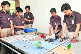 Students of Manav Rachna International School display models at a felicitation ceremony in Gurgaon