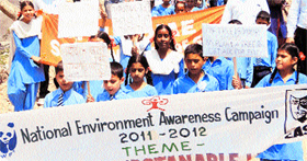Schoolchildren participate in a rally as part of the national environment awareness campaign in Reasi.