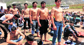 Candidates queue up for the physical measurement test at the police recruitment rally in Reasi on Monday.