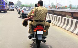 Policemen have been instructed to wear helmets while riding two-wheelers. Those penalising violators have been asked not to spare their colleagues if they are found violating the traffic norms