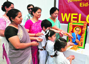 Teachers and students pay tributes to Dr BR Ambedkar on his 121st birth anniversary at Alexander Memorial School in Jammu on Monday. 