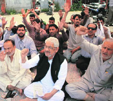 Members of the All-Party Action Committee of the Chenab Valley Autonomous Hill Development Council stage a protest in Jammu on Monday.