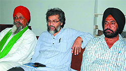 National general secretary of the CPI (ML) Liberation Deepankar Bhattacharya (centre) addresses mediapersons in Bathinda on Tuesday