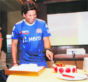 Sachin Tendulkar cuts his birthday cake on Tuesday.