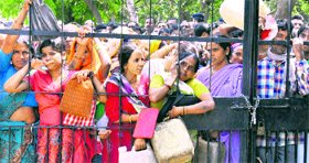 Residents wait for kerosene at the Sector-29 oil depot in Chandigarh on Tuesday.