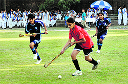 A match in progress in the Welham Girls School Invitational Hockey Tournament in Dehradun on Tuesday