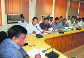 Udham Singh Nagar District Magistrate Brijesh Sant addresses a meeting of district officials on Tuesday
