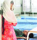Poonam under treatment in the Gurgaon Civil Hospital