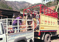LPG cylinders being unloaded from a vehicle at Ramban