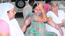 Family members of the deceased at the Civil Hospital in Jalandhar on Tuesday.