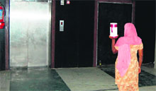 A woman faces the daily ordeal of taking the stairs as the only lift is switched off at Bebe Nanki Mother and Child Care Centre in Amritsar. 
