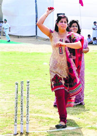 First love Madhu Arora, former Indian cricketer, bowls before inaugurating the Inter-School T-10 Cricket Tournament in Amritsar on Wednesday