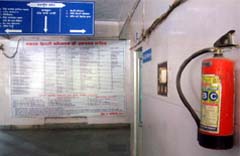 An expired fire extinguisher hanging on a wall at the entrance of the District Administrative Complex in Muktsar
