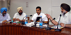 Registrar, cooperative societies, Punjab, Kirandeep SIngh Bhullar (extreme right) holds meeting with Deputy Commissioner KK Yadav (second from right) and officers of the procurement agencies regarding the procurement of wheat in Bathinda on Wednesday
