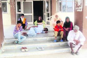 Cancer patient Chhinda, who was shown the door by health authorities in Jakhal, Fatehabad, lying on the floor