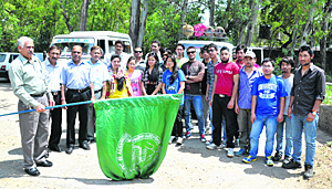 Prof Dhian S. Bhau, Director, Directorate of Sports and Physical Education, University of Jammu, flags off a kayaking contingent on Wednesday.