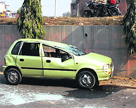 A file photo of a car that skidded off the PAP flyover in Jalandhar as there are no sidewalls along the bridge.