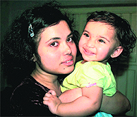 Sagarika Bhattacharjee with her daughter Aishwarya at Sinthi in North 24 Pargana district of West Bengal on Wednesday