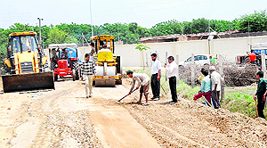 Work in progress for constructing a new road near the inauguration venue