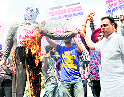 Activists of various student organisations burn an effigy of Thapar University director in Patiala on Wednesday