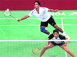 Indias Ashwini Ponnappa and Tarun Kona in action during their mix-doubles match at Yonex Sunrise India Open in New Delhi on Wednesday