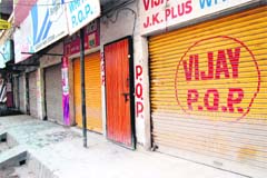 Traders closed their shops to protest against the demolition drive of the MC in Amritsar
