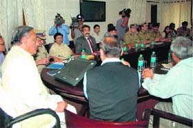 Uttarakhand Chief Minister Vijay Bahuguna addresses a meeting of senior police and civil officials at his residence in Dehradun on Thursday