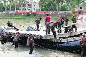 Sappers construct a raft on the Ganga canal as a part of Exercise Jal Tarang in Roorkee on Thursday