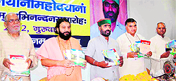Education Minister Mantri Prasad Naithani launches a book on Sanskrit, written by Dr Buddh Dev Sharma, in Haridwar on Thursday