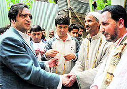 Sajjad Lone meets locals in Ganderbal