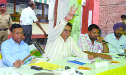 PUDA officials during the auction in Jalandhar on Thursday. 